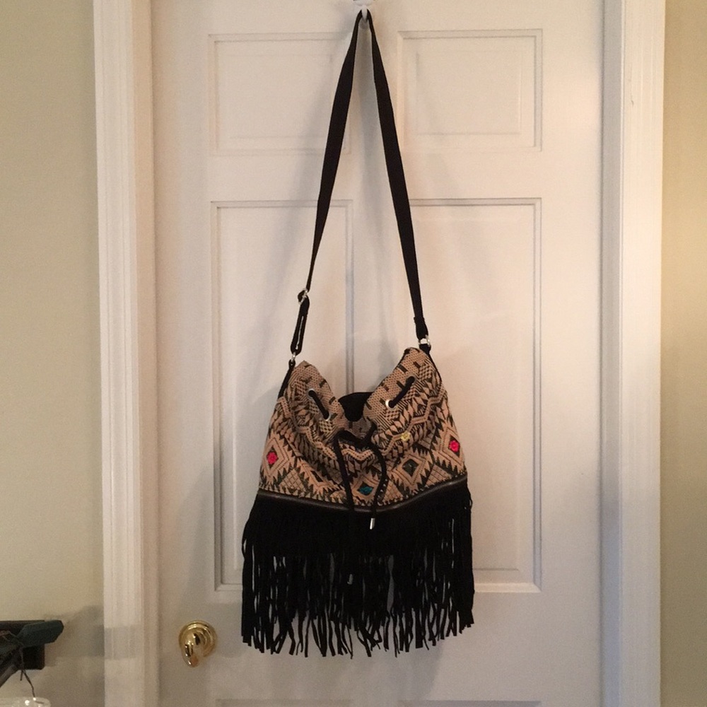 Urban Outfitters crossbody fringe bucket bag.